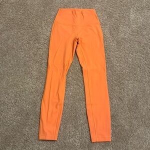 Lululemon Wonder Under leggings size 2 25” (orange soda)
